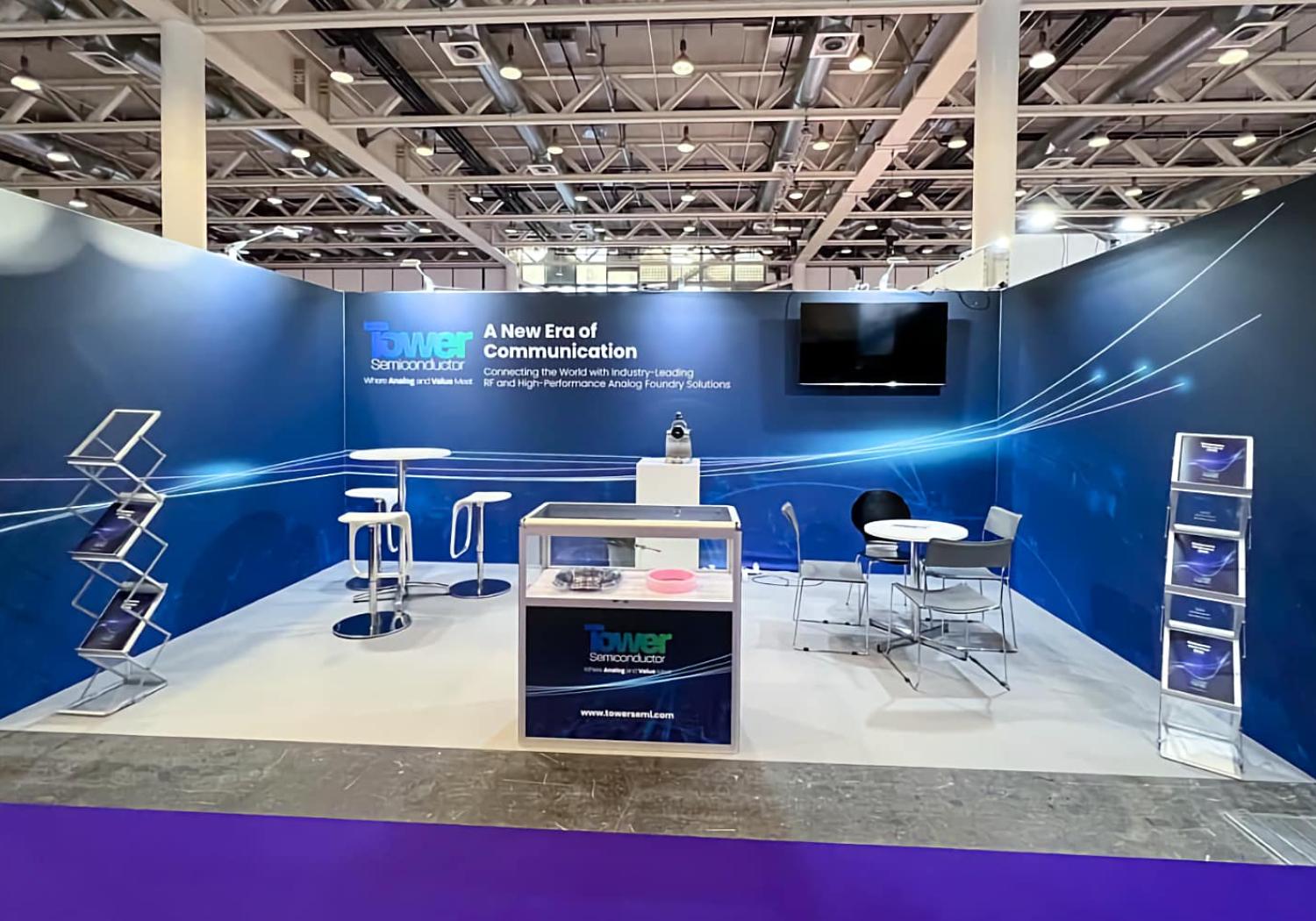 Stand for Tower Semiconductors, 3 walls, 2 tables/chairs, 2 literature racks and a display counter